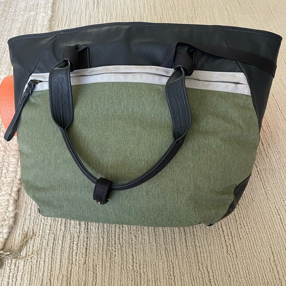 Lululemon gym bag. EUC. Loads of pockets. Very sturdy construction. - Picture 3 of 9